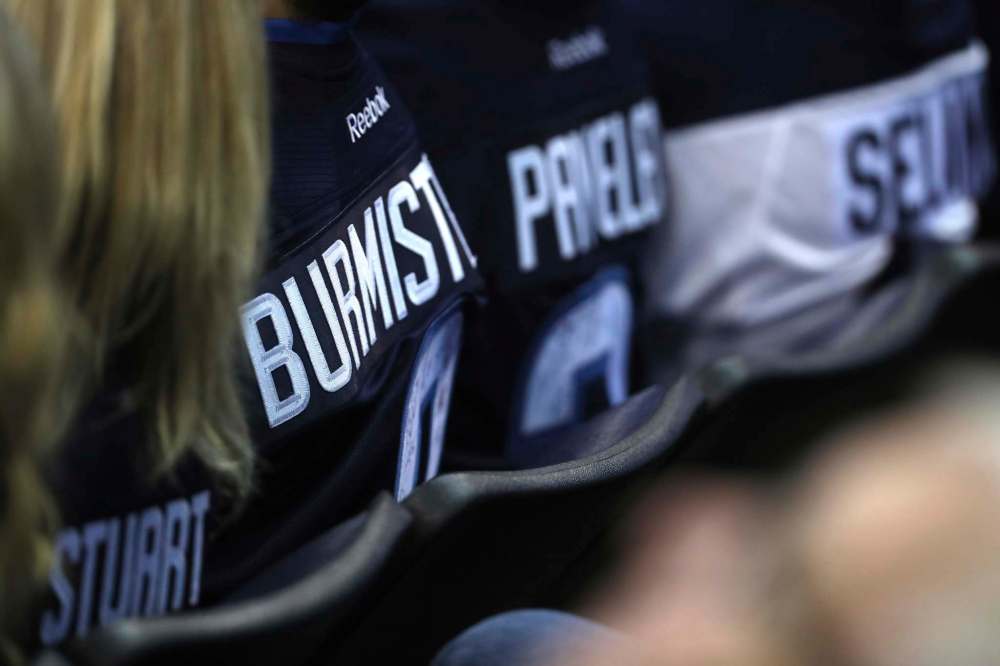 TREVOR HAGAN / WINNIPEG FREE PRESS
Winnipeg Jets fans with jerseys of former players, Mark Stuart, Alexander Burmistrov, Ondrej Pavelec and Teemu Selanne, in the crowd during NHL hockey action against the Toronto Maple Leafs' on Wednesday.