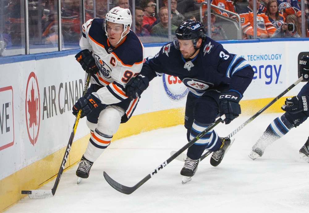 THE CANADIAN PRESS/Jason Franson
The return of Matt Hendricks to the Winnipeg Jets' 23-man-roster might necessitate the movement of Tucker Poolman, right, to the Moose in order to see some game action.