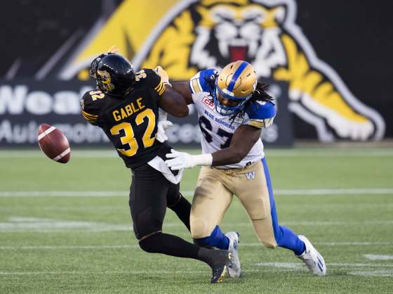 THE CANADIAN PRESS/Aaron LynettHamilton Tiger-Cats running back C.J. Gable collides with Winnipeg Blue Bombers' Cory Johnson when their teams first met in August. The competition from the Ticats in that matchup is not indicative of the level of play the Bombers expect this time around.