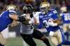 JOHN WOODS / THE CANADIAN PRESS
Andrew Harris attempts to get around Hamilton Tiger-Cats' Davon Coleman Friday night.