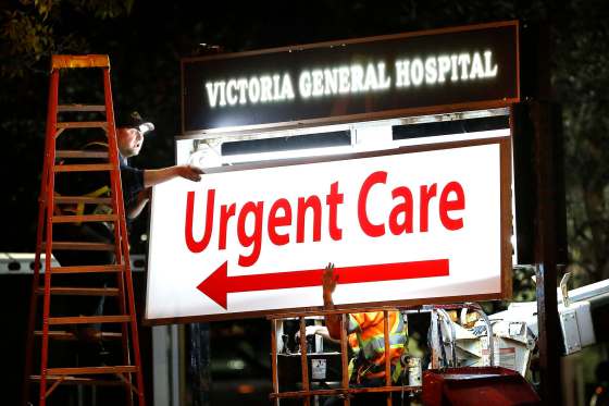 JOHN WOODS / WINNIPEG FREE PRESSA sign crew removes Emergency and installs Urgent Care signage at Victoria General Hospital in Winnipeg Monday, October 2, 2017.