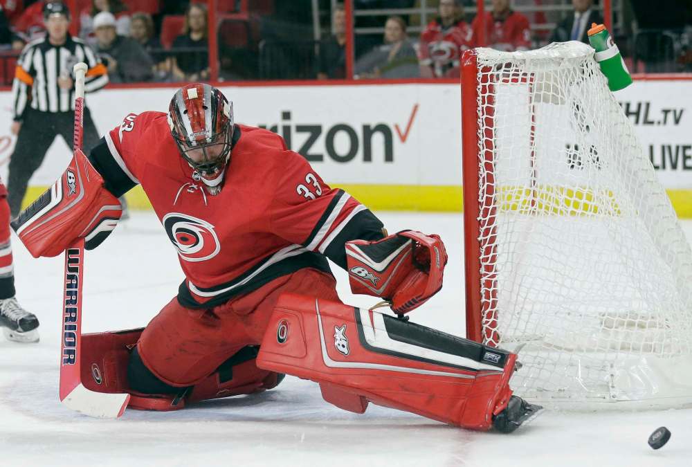 Gerry Broome / The Associated Press
Scott Darling deflects the puck during the first period against the Columbus Blue Jackets in Raleigh, N.C., Tuesday.