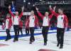 Newfoundland and Labrador's Brad Gushue, Mark Nichols, Brett Gallant, Geoff Walker and coach Jules Owchar, right to left, head down the rink after defeating Team Canada 7-6 to win the Tim Hortons Brier curling championship at Mile One Centre in St. John's on Sunday, March 12, 2017. THE CANADIAN PRESS/Andrew Vaughan