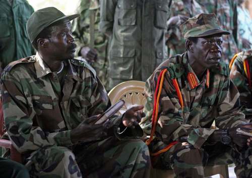 Stuart Price / The Associated Press files
In this 2006 photo, Joseph Kony (left), leader of the Lord&rsquo;s Resistance Army, and his deputy Vincent Otti sit inside a tent at Ri-Kwamba in southern Sudan.