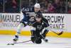 Mark J. Terrill / The Associated Press Files
Los Angeles Kings defenseman Drew Doughty, right, is pushed down by Winnipeg Jets left wing Brandon Tanev.
