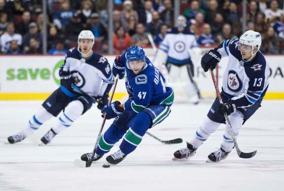 Darryl Dyck / The Canadian Press FilesBrandon Tanev (right) follows Vancouver's Sven Baertschi as he handles the puck during the third period of a game between the teams Oct. 12.