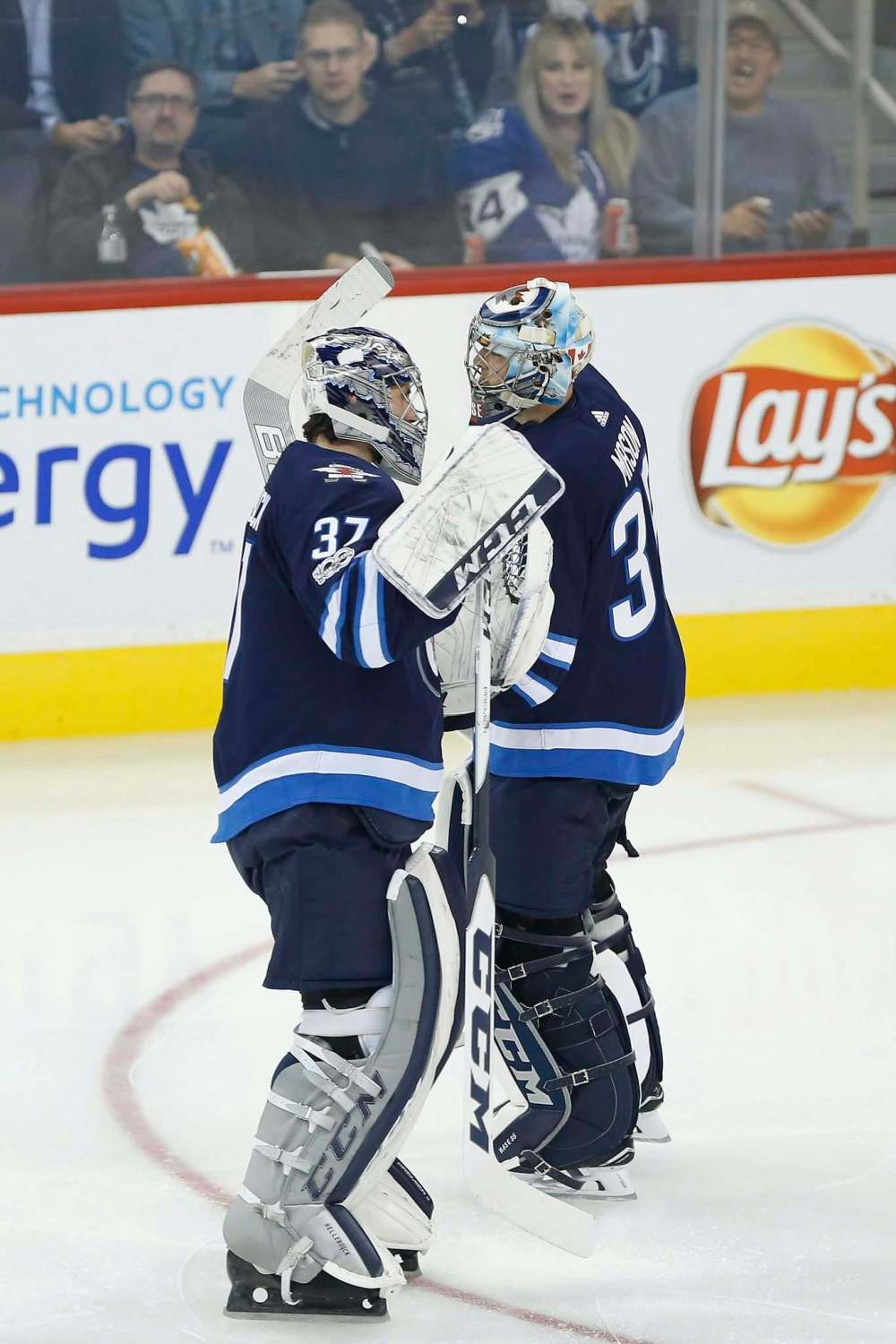John Woods / The Canadian Press
Winnipeg Jets goaltender Connor Hellebuyck replaces Steve Mason during third period NHL action against the Toronto Maple Leafs in Winnipeg on Wednesday, October 4, 2017.