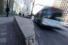 JOHN WOODS / WINNIPEG FREE PRESS
A bus rolls past pedestrian barriers in Winnipeg on Monday. Transit officials are leery of reopening Portage and Main to pedestrians.