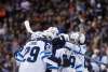 Winnipeg Jets' Josh Morrissey, from left, Patrik Laine, of Finland, Jacob Trouba, Bryan Little and Mathieu Perreault celebrate Morrissey's goal against the Vancouver Canucks during the first period of an NHL hockey game in Vancouver, B.C., on Thursday October 12, 2017. THE CANADIAN PRESS/Darryl Dyck