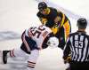 Gene J. Puskar / The Associated Press
Pittsburgh Penguins’ Ryan Reaves, right, fights with Edmonton Oilers’ Darnell Nurse in the first period of their NHL hockey game in Pittsburgh, Tuesday.