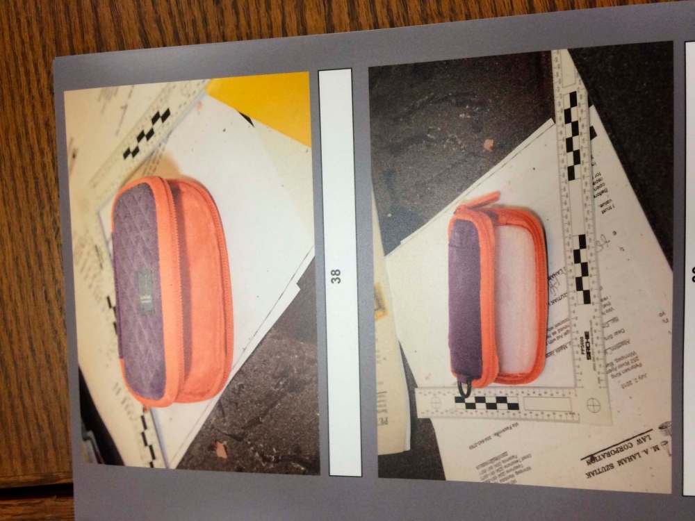 This photo of a purple and orange pouch was entered as an exhibit in the provincial court trial for Guido Amsel. The pouch was found on Maria Mitousis' desk after an explosion in her law office took her right hand. A swab of the pouch tested positive for explosives, court heard.