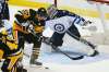 AP Photo/Gene J. Puskar
Pittsburgh Penguins' Sidney Crosby can't get his stick on a rebound in front of Winnipeg Jets goalie Connor Hellebuyck in the first period of their game in Pittsburgh, Thursday.