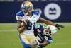 THE CANADIAN PRESS/Nathan Denette
Winnipeg Blue Bombers wide receiver Chris Givens evades a tackle by Toronto Argonauts Jermaine Gabriel during their game in Toronto last Saturday. Givens would like to be Bombers quarterback Matt Nichols' go to guy on offence.
