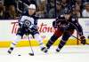 Winnipeg Jets forward Brandon Tanev, left, works against Columbus Blue Jackets defenseman Jack Johnson during the second period of an NHL hockey game in Columbus, Ohio, Friday, Oct. 27, 2017. (AP Photo/Paul Vernon)