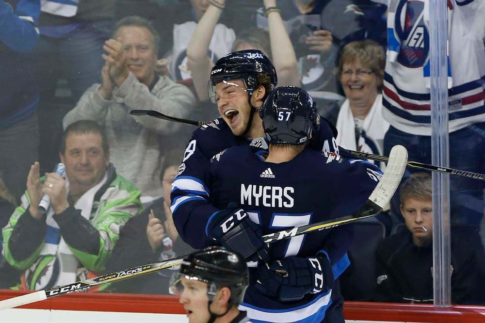 JOHN WOODS / CANADIAN PRESS FILES
Brendan Lemieux and Tyler Myers celebrate Lemieux's first NHL goal on Sunday, Oct. 29.