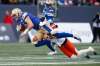 Winnipeg Blue Bombers quarterback Dan LeFevour (13) gets stopped by B.C. Lions defensive back Buddy Jackson (3) as he attempts to gain extra yards during the first half of CFL action in Winnipeg on Saturday, October 14, 2017. THE CANADIAN PRESS/John Woods