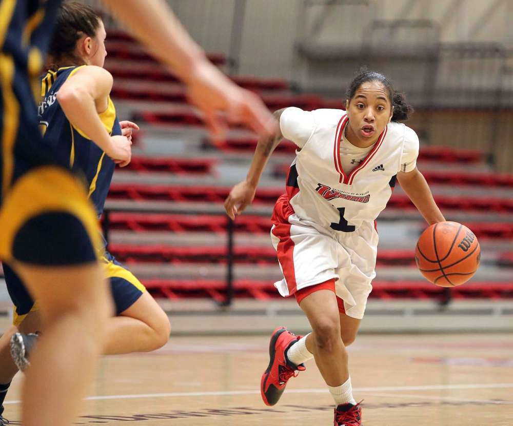JASON HALSTEAD / WINNIPEG FREE PRESS FILES
Wesmen guard Antoinette Miller (right) is being counted on to lead a team that lost some key players from last season and is down to just eight healthy players this season.