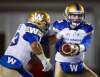 JEFF MCINTOSH / THE CANADIAN PRESS
Andrew Harris (left) takes the handoff from quarterback Dan LeFevour Friday. Harris became the league’s leading rusher for the first time in his career. Running back Timothy Flanders (above) will help complement the run game against Edmonton Sunday.