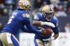 JOHN WOODS / CANADIAN PRESS FILES
Voted the team’s most outstanding Canadian, Andrew Harris (33) led the league in rushing, with 1,035 yards, and set a new CFL record for most catches in a season by a running back, with 105.