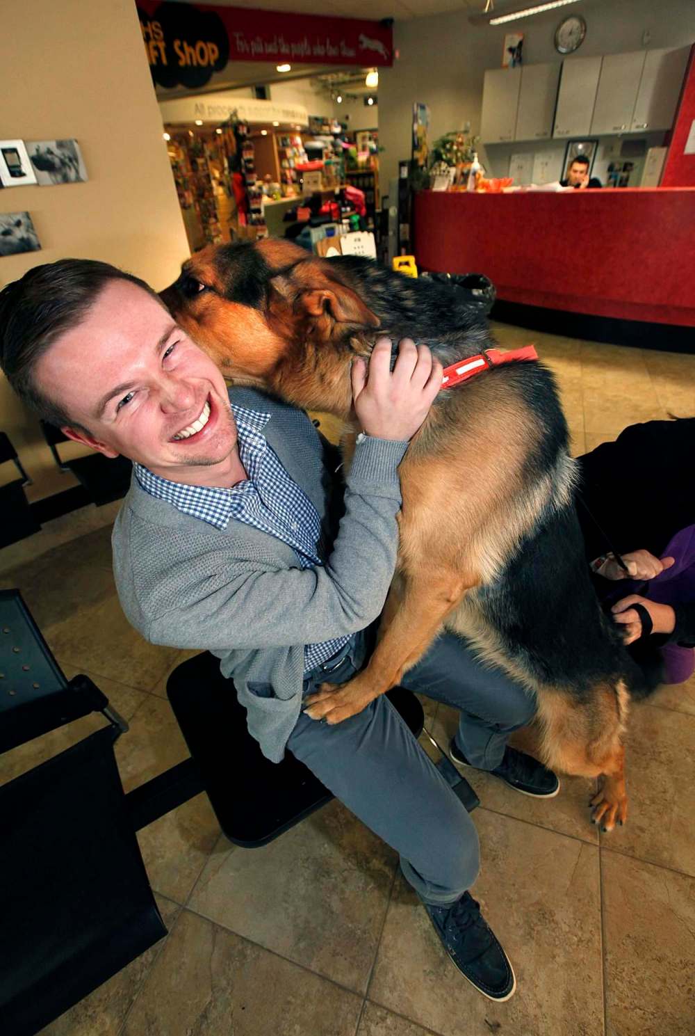 PHIL HOSSACK / WINNIPEG FREE PRESS
Humane Society’s Kyle Jahns with King, a Shepherd cross who was on the operating table when alarms sounded and the Humane Society was evacuated due to a flood Monday.