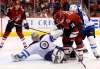(AP Photo/Ross D. Franklin)
Winnipeg Jets goalie Steve Mason, front, makes a sliding save on a shot by Arizona Coyotes centre Christian Dvorak during the second period of an NHL hockey game Saturday, Nov. 11 in Glendale, Ariz.