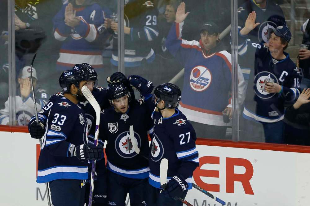 JOHN WOODS / WINNIPEG FREE PRESS
Winnipeg Jets celebrate Bryan Little's goal against the Arizona Coyotes during second period in Winnipeg on Tuesday. It was Little's second goal of the season and his first in 11 games.