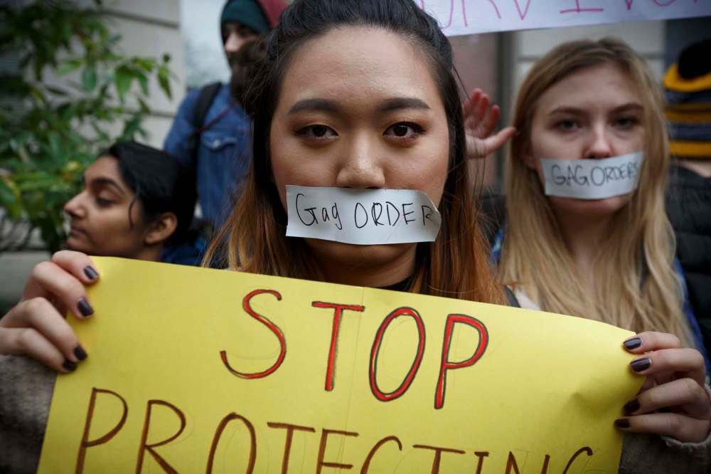 Dina Rudick / Boston Globe files
A student at the Berklee College of Music in Boston protests against sexual harassment.