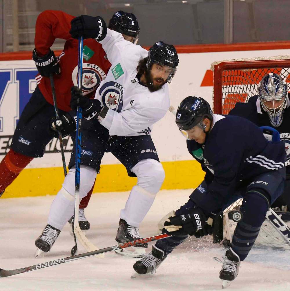 WAYNE GLOWACKI / WINNIPEG FREE PRESS
Mathieu Perreault's return means coach Paul Maurice has some tough decisions to make.