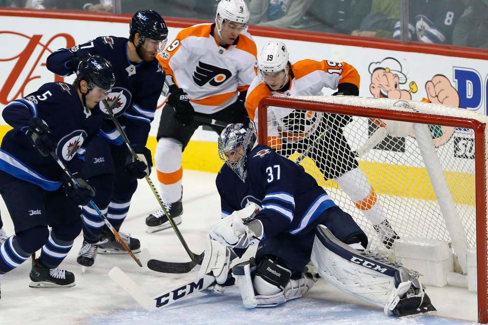 John Woods / The Canadian Press
Connor Hellebuyck let in two goals early against the Philadelphia Flyers, but settled down and stopped 30 of 32 on the night.