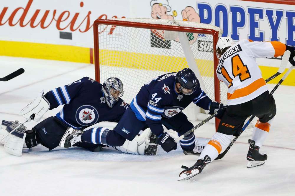 John Woods / The Canadian Press FILES
Winnipeg Jets goaltender Connor Hellebuyck and defenceman Josh Morrissey have helped propel the Jets into a lofty place in the NHL standings with a quarter of the season already gone.