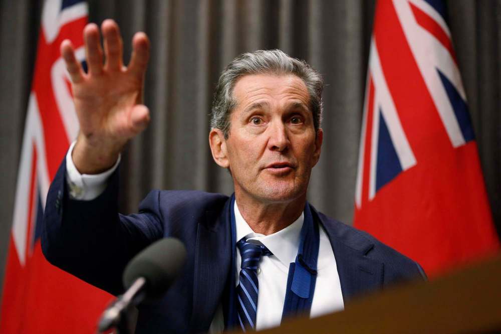 Manitoba Premier Brian Pallister speaks to media at an embargoed press conference before the provincial throne speech at the Manitoba Legislature in Winnipeg, Tuesday, November 21, 2017. (John Woods / The Canadian Press)