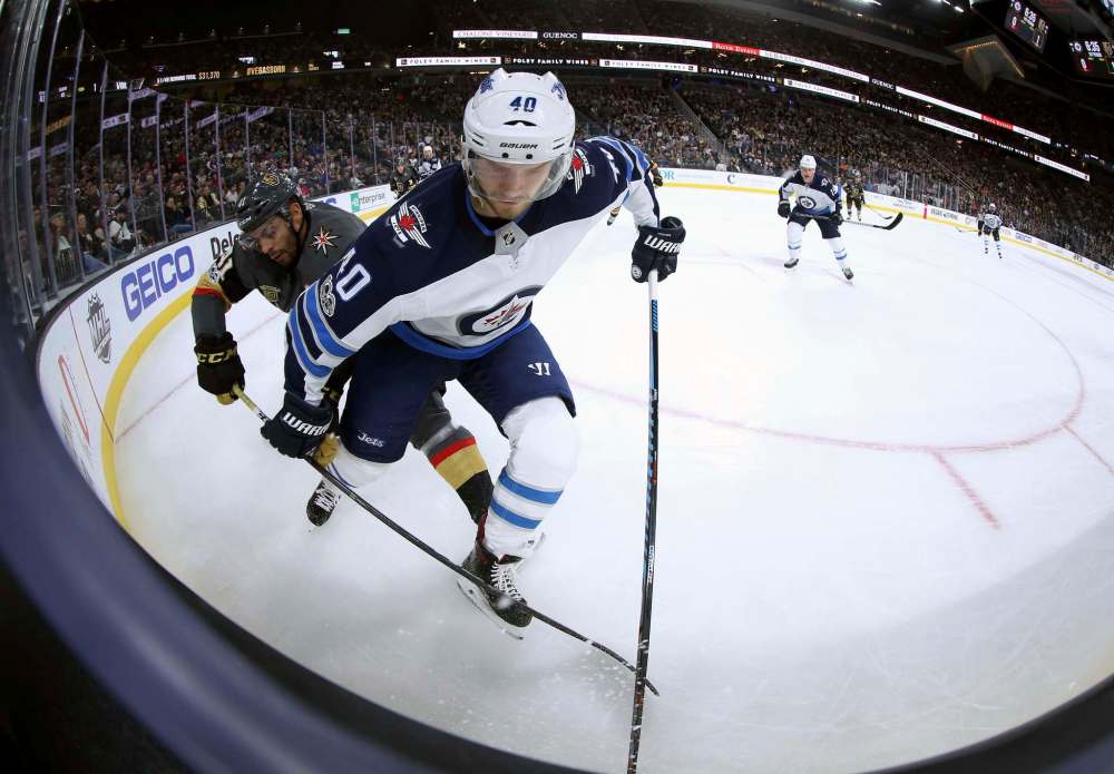 TREVOR HAGAN / WINNIPEG FREE PRESS
Vegas Golden Knights' Pierre-Edouard Bellemare and Winnipeg Jets' Joel Armia (40) battle for the puck during first period NHL action at T-Mobile Arena, in Las Vegas, Friday, November 10, 2017.