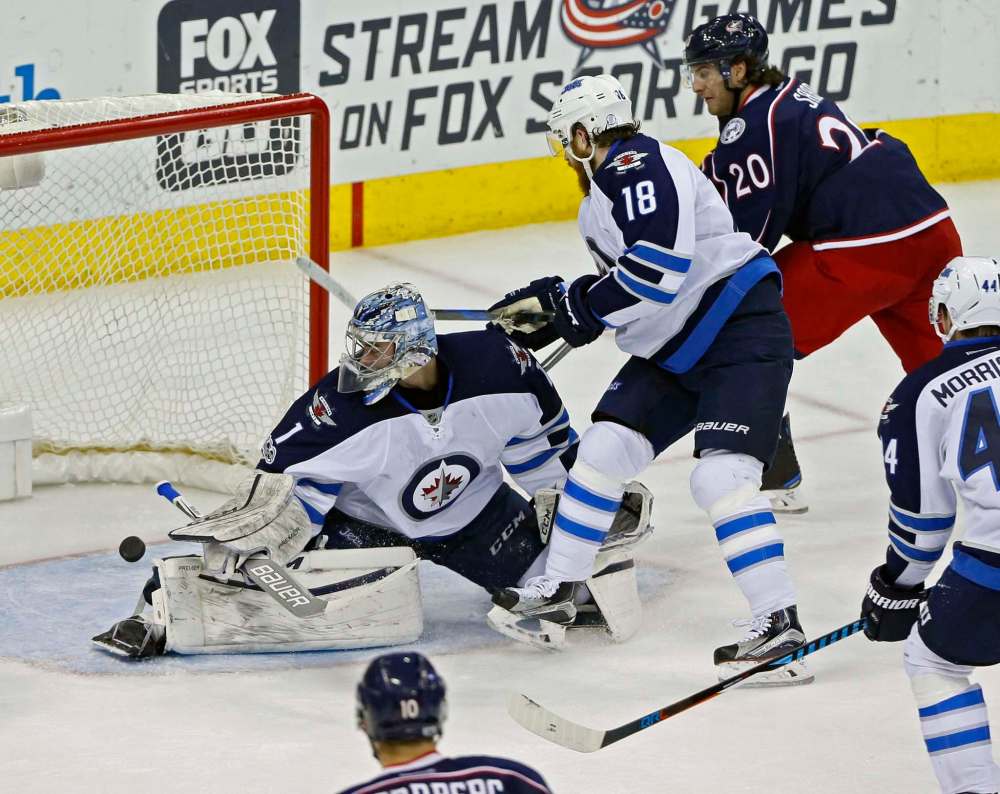 Kyle Robertson / Columbus Dispatch Files
Eric Comrie played one game in net for the Jets last season, helping Winnipeg beat the Columbus Blue Jackets 5-4 on April 6, 2017.
