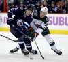 THE CANADIAN PRESS/Trevor Hagan
Winnipeg Jets' Andrew Copp and Minnesota Wild's Gustav Olofsson battle for the puck during the second period, Monday.