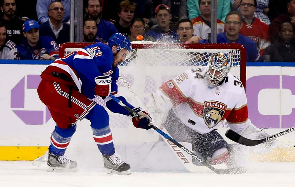 Julie Jacobson / The Associated Press FILES
Florida Panthers goalie James Reimer blocks a shot as New York Rangers centre Kevin Hayes looks for the rebound during a game in November.