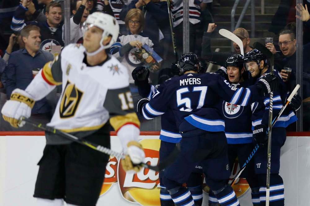 THE CANADIAN PRESS/John Woods
Winnipeg Jets' Tyler Myers, Matt Hendricks and Joel Armia celebrate Hendricks' goal during second period against the Las Vegas Golden Knights, Friday.
