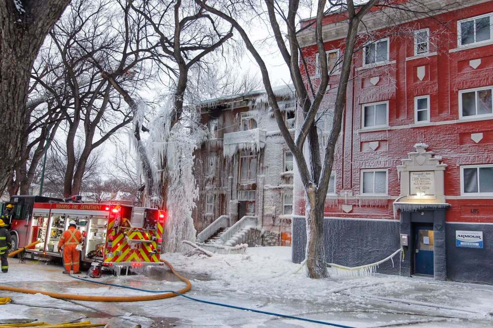 BORIS MINKEVICH / WINNIPEG FREE PRESS
Firefighters worked overnight to extinguish the blaze on Furby Street.