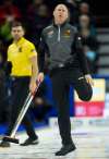 THE CANADIAN PRESS/Adrian Wyld
Skip Kevin Koe, from Calgary, Alta reacts to his shot entering the house during third end action against Team McEwen at the Olympic curling trials Tuesday December 5, 2017 in Ottawa.