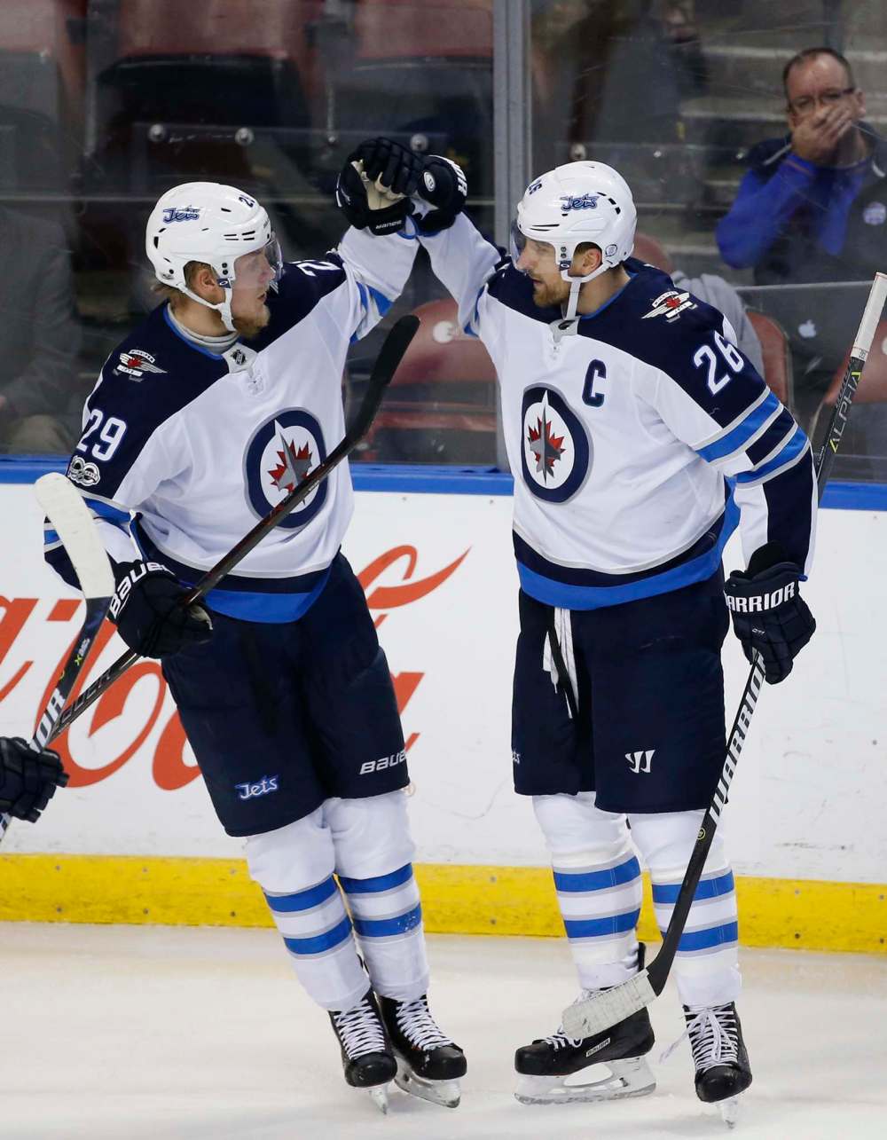 AP Photo/Wilfredo Lee
Winnipeg Jets right wing Patrik Laine congratulates right wing Blake Wheeler after Wheeler scored during the second period.