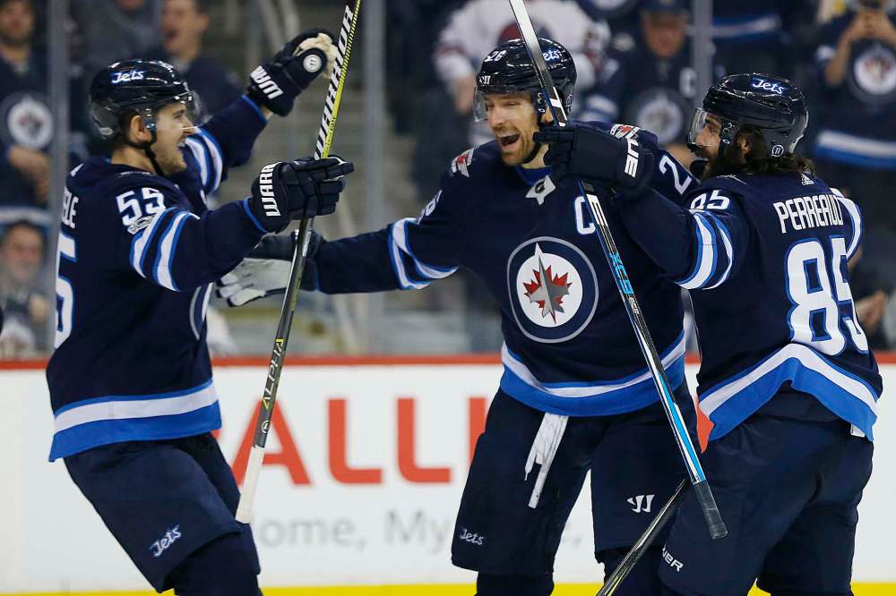 JOHN WOODS / WINNIPEG FREE PRESS
Winnipeg Jets' Mark Scheifele, Blake Wheeler and Mathieu Perreault celebrate Wheeler's goal against the Ottawa Senators on Sunday. Has it really only been less than a week since the Jets won?