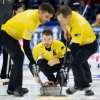 THE CANADIAN PRESS/Adrian Wyld
Skip Mike McEwen, from Winnipeg watches his rock as second Matt Wozniak and lead Denni Neufeld sweep during Olympic curling trials action in Ottawa. Team McEwen's Olympic hopes come down to one game Saturday.