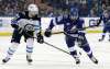 CHRIS O'MEARA / THE ASSOCIATED PRESS
Tampa Bay Lightning right wing Nikita Kucherov (86) bats the puck away from Winnipeg Jets defenseman Josh Morrissey (44) during the second period of an NHL hockey game Saturday, Dec. 9, 2017, in Tampa, Fla.