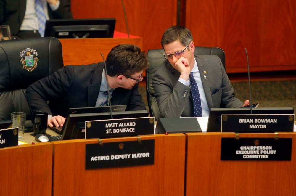 BORIS MINKEVICH / WINNIPEG FREE PRESS
From left, Matt Allard and Mayor Brian Bowman during the council debate on the city's new Vehicle for Hire bylaw.
