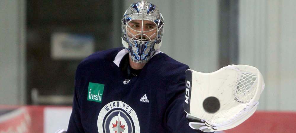 BORIS MINKEVICH / WINNIPEG FREE PRESS
Winnipeg Jets goalie Connor Hellebuyck surveys the Bell MTS Iceplex during practice Friday. He’ll start in net for one of the two games against the St. Louis Blues this weekend, while Steve Mason gets the nod from coach Paul Maurice in the other contest.