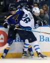 (AP Photo/Bill Boyce)
St. Louis Blues' Jay Bouwmeester tangles with Winnipeg Jets' Blake Wheeler. The Jets are expecting a pair of physical affairs when they play the Blues for the first and second time this season in a set of back-to-back games this weekend.