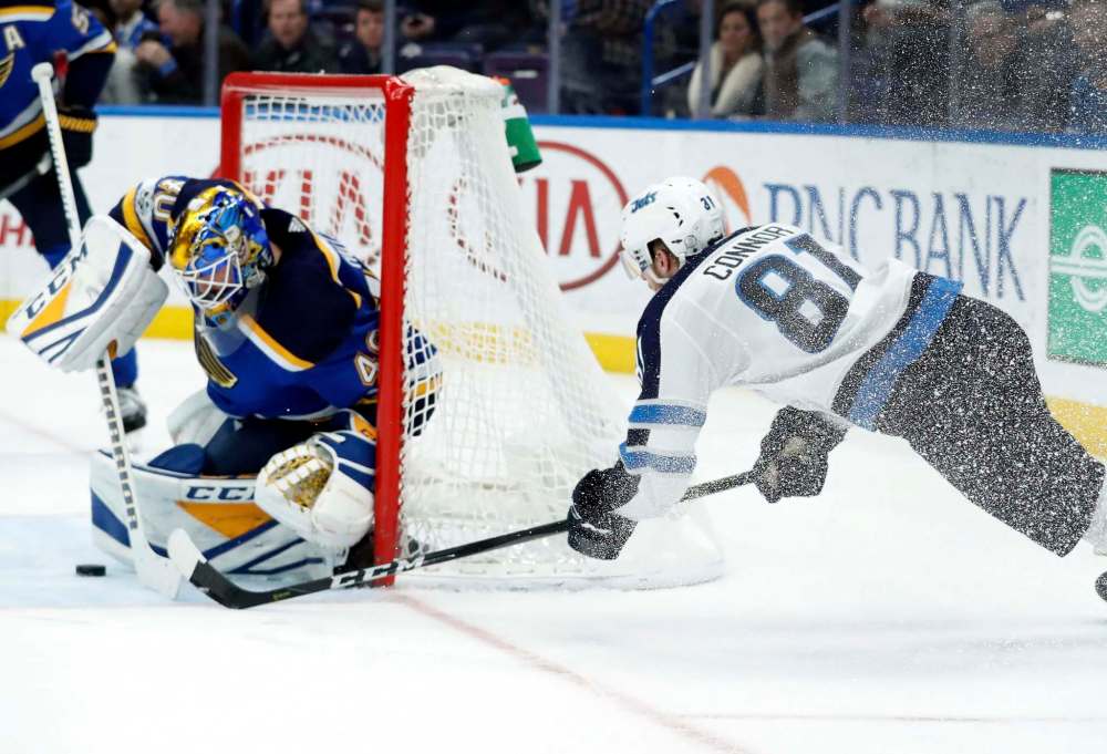 Winnipeg Jets' Kyle Connor (81) is unable to score past St. Louis Blues goalie Carter Hutton, left, during the third period of an NHL hockey game Saturday, Dec. 16, 2017, in St. Louis. (AP Photo/Jeff Roberson)