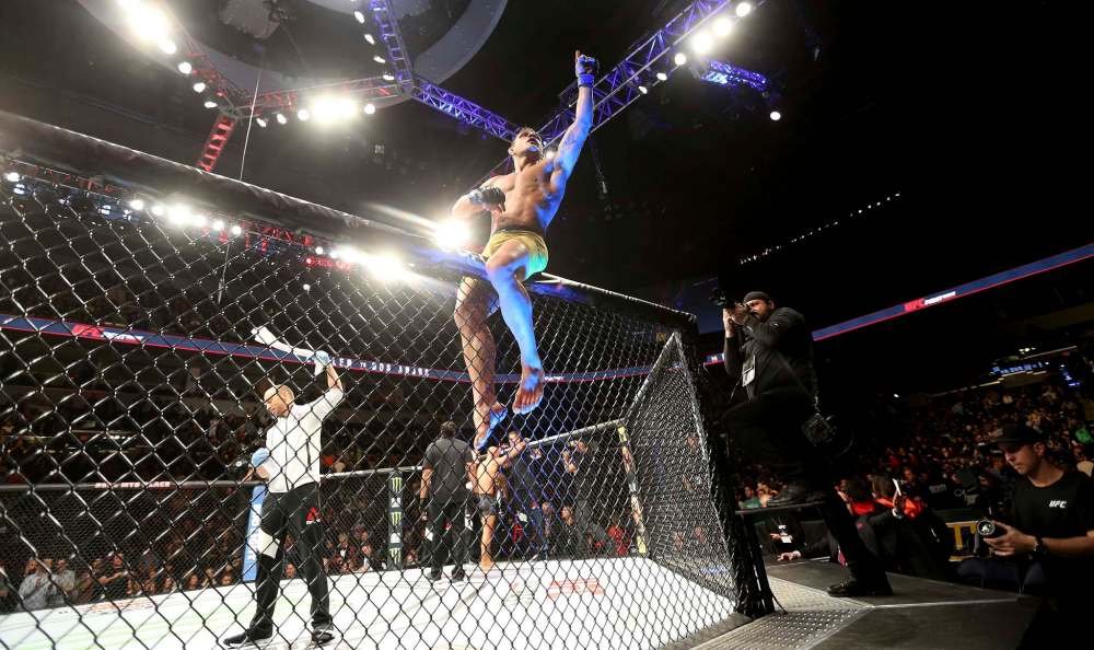 TREVOR HAGAN / WINNIPEG FREE PRESS
Rafael dos Anjos celebrates after defeating Robbie Lawler during the main event at UFC on Fox 26 at Bell MTS Place.