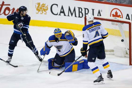 JOHN WOODS / WINNIPEG FREE PRESSKyle Connor watches Josh Morrissey's shot zip past St. Louis Blues' goaltender Jake Allen in the third period Sunday.