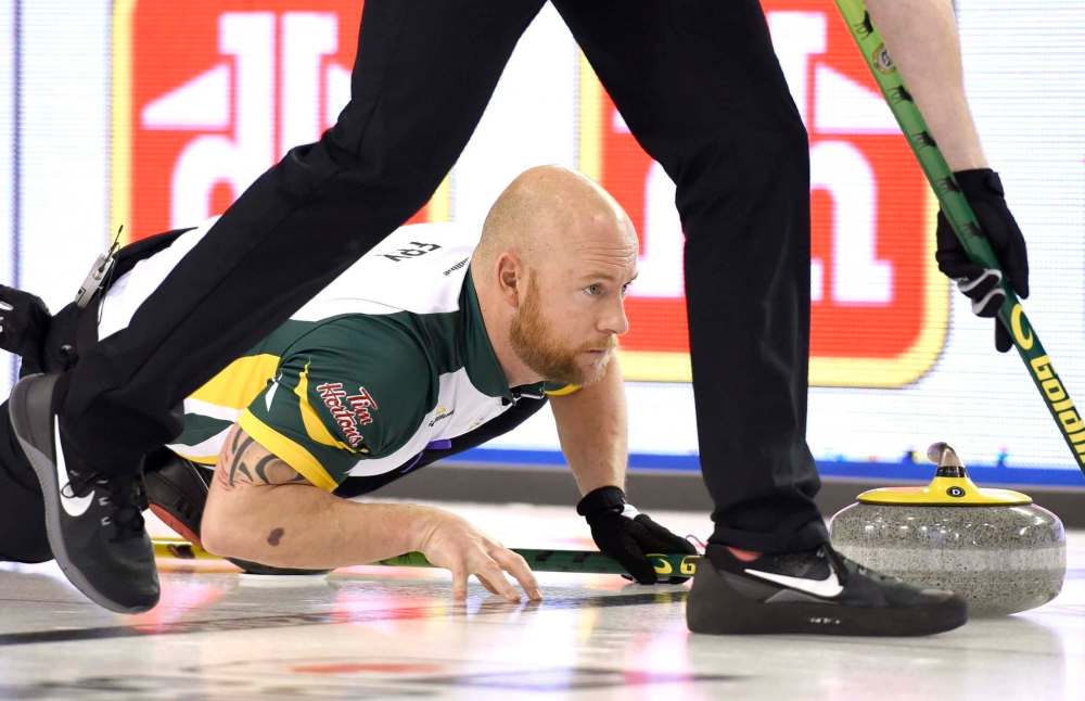 Northern Ontario third Ryan Fry watches his shot during a draw against Quebec at the Tim Hortons Brier, Sunday March 6, 2016, in Ottawa. (Justin Tang / The Canadian Press files)