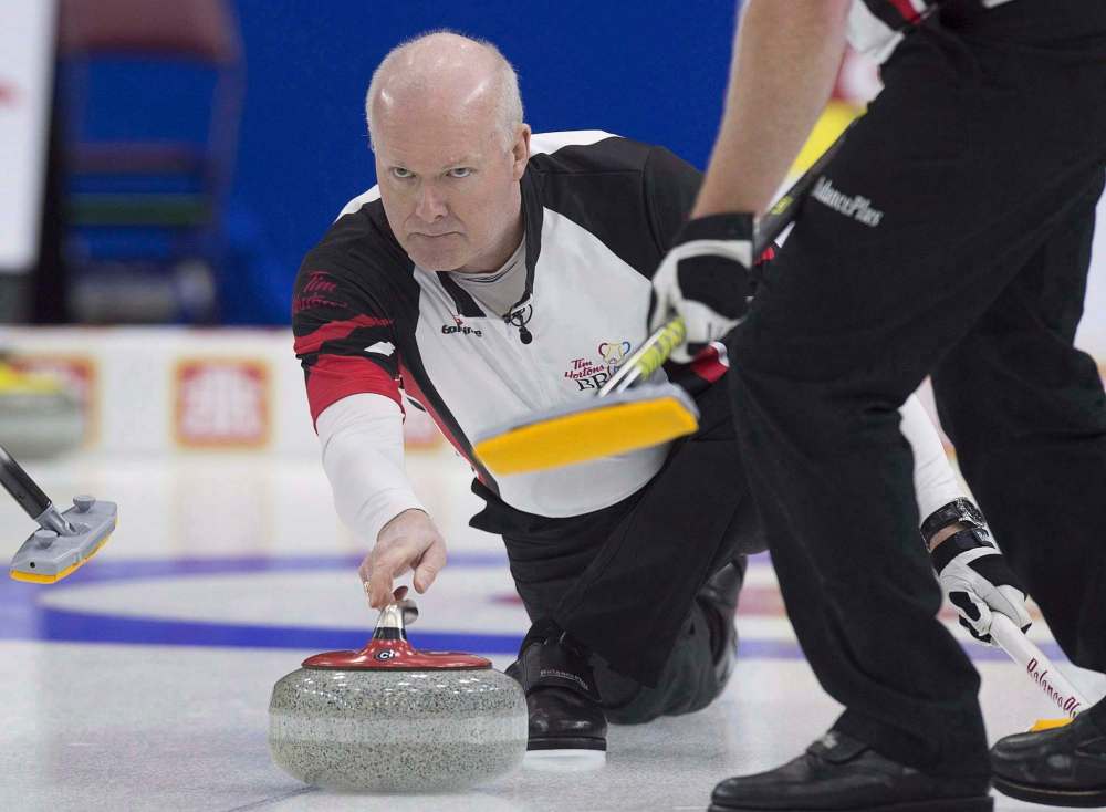 Ontario skip Glenn Howard delivers a rock against Nova Scotia at the Tim Hortons Brier curling championship at Mile One Centre, in St. John's on March 4, 2017. (Andrew Vaughan/The Canadian Press)